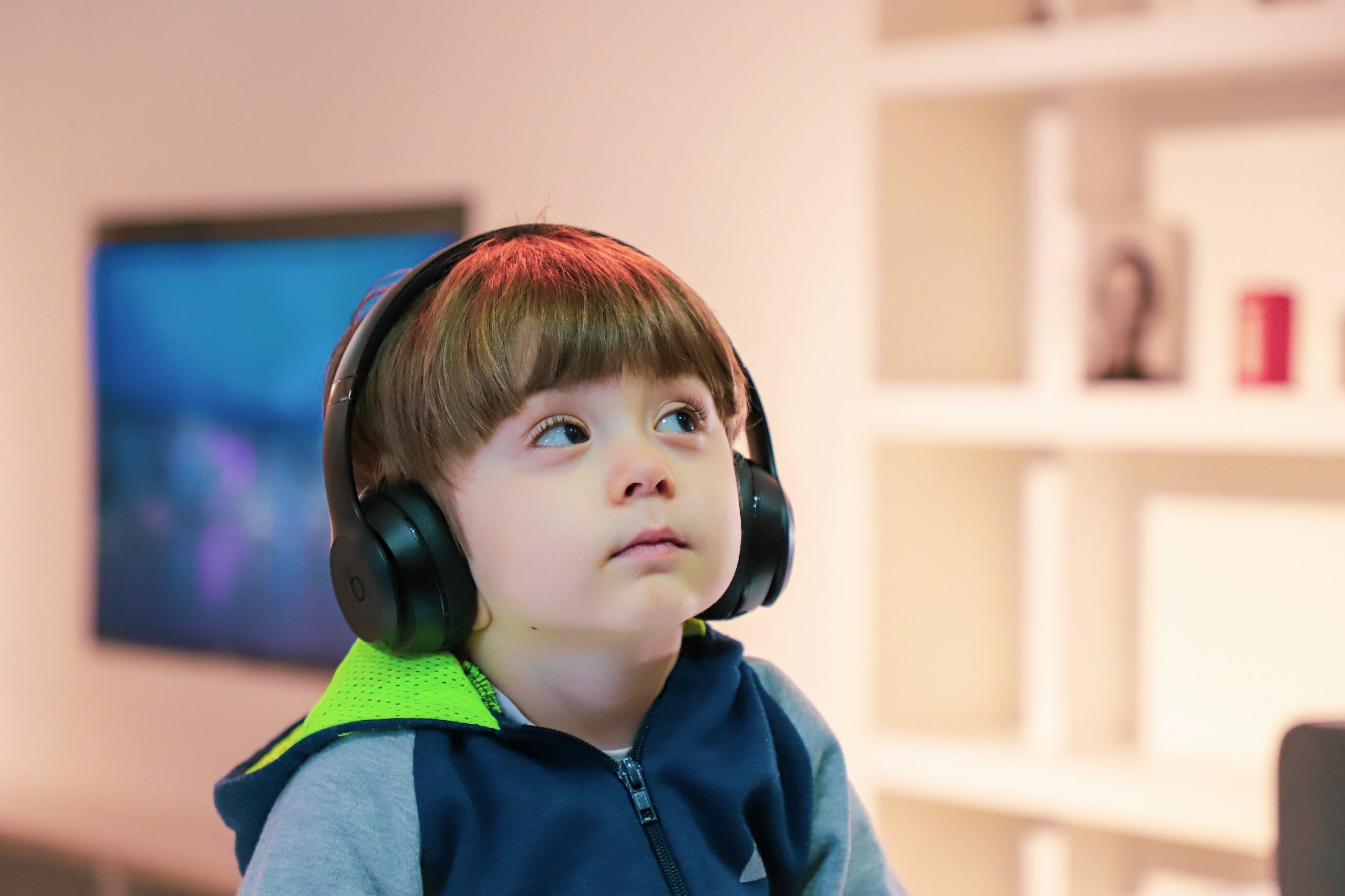 child listening to headphones