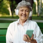 Older woman with headphones Text-to-speech